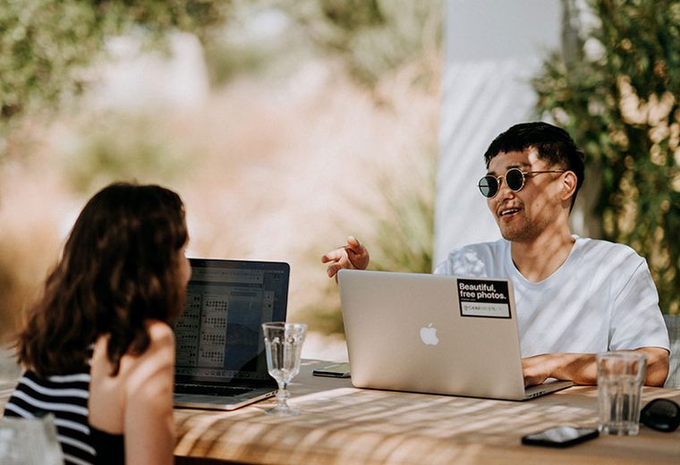 Colleagues working at a shared desk